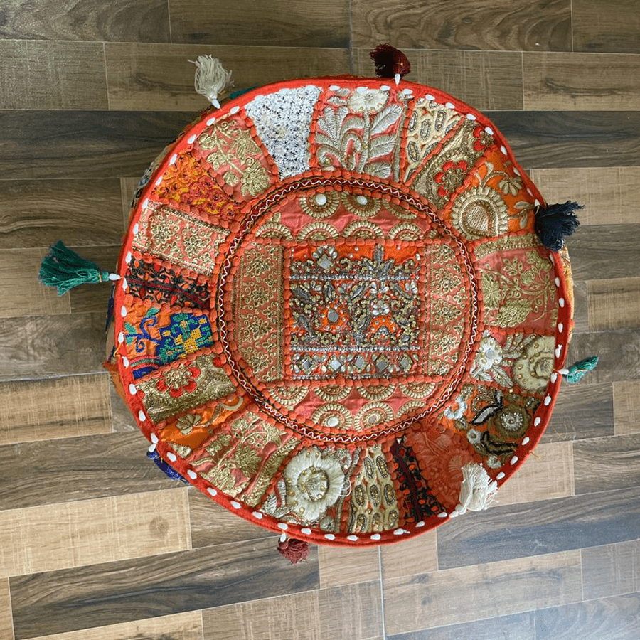 A handmade orange coloured Pouf With embroidery perfect for living room
